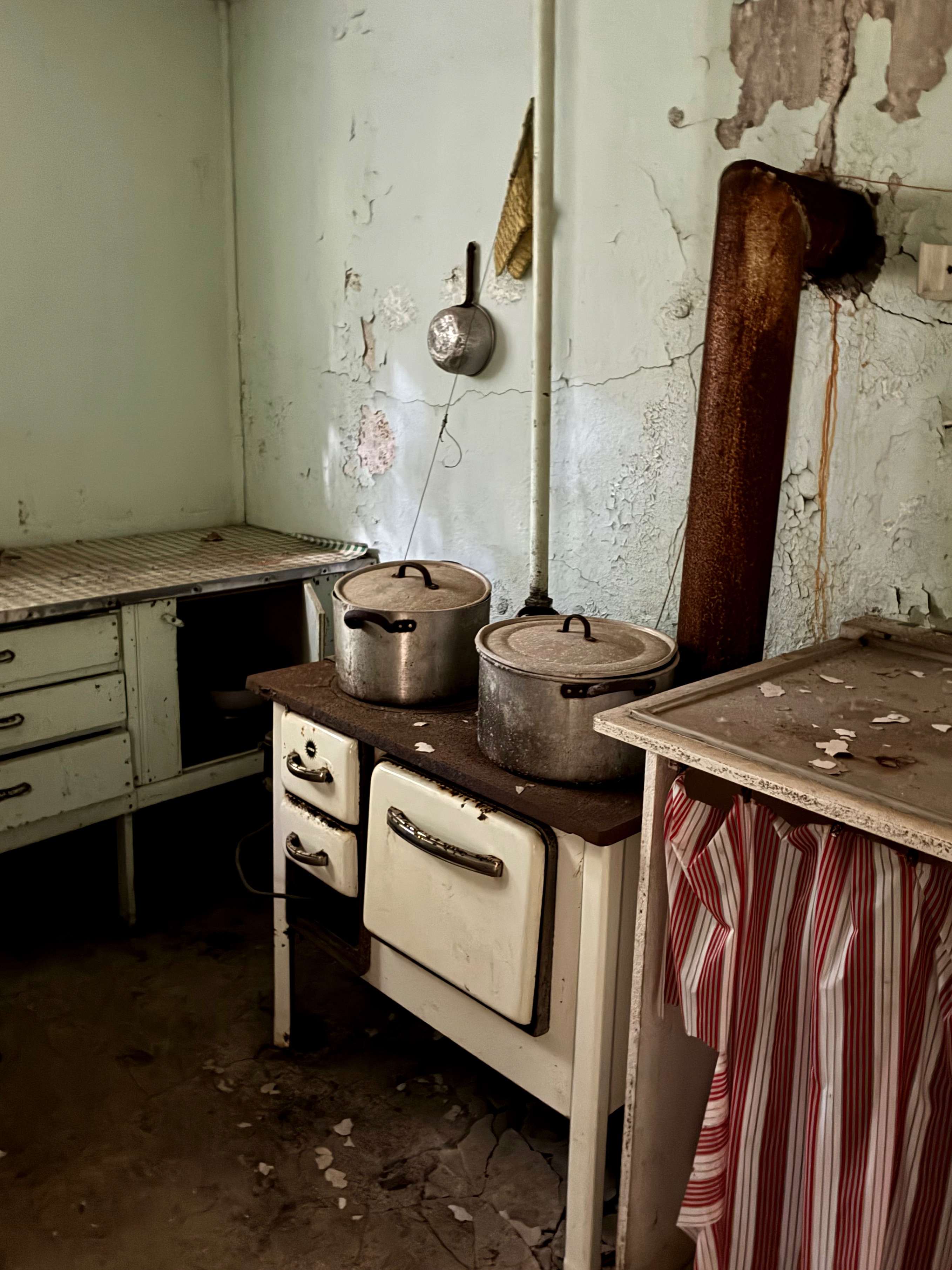 An old stove inside an abandoned house.