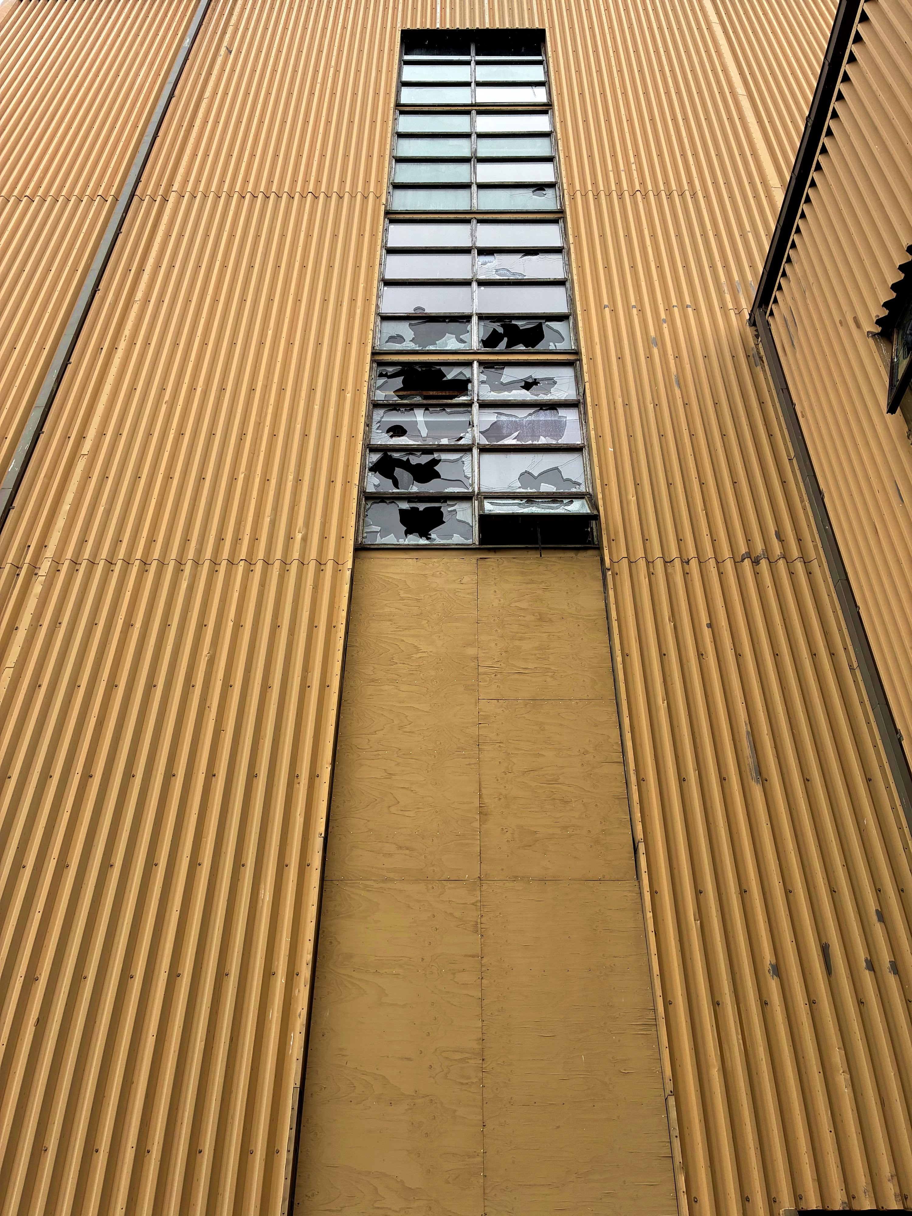 Broken windows on an abandoned building.